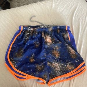 Blue and orange Nike running shorts
